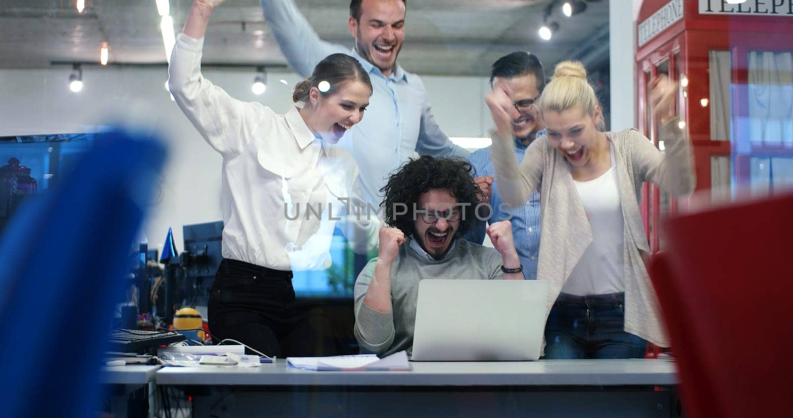 Group of a young business people discussing business plan at modern startup office building