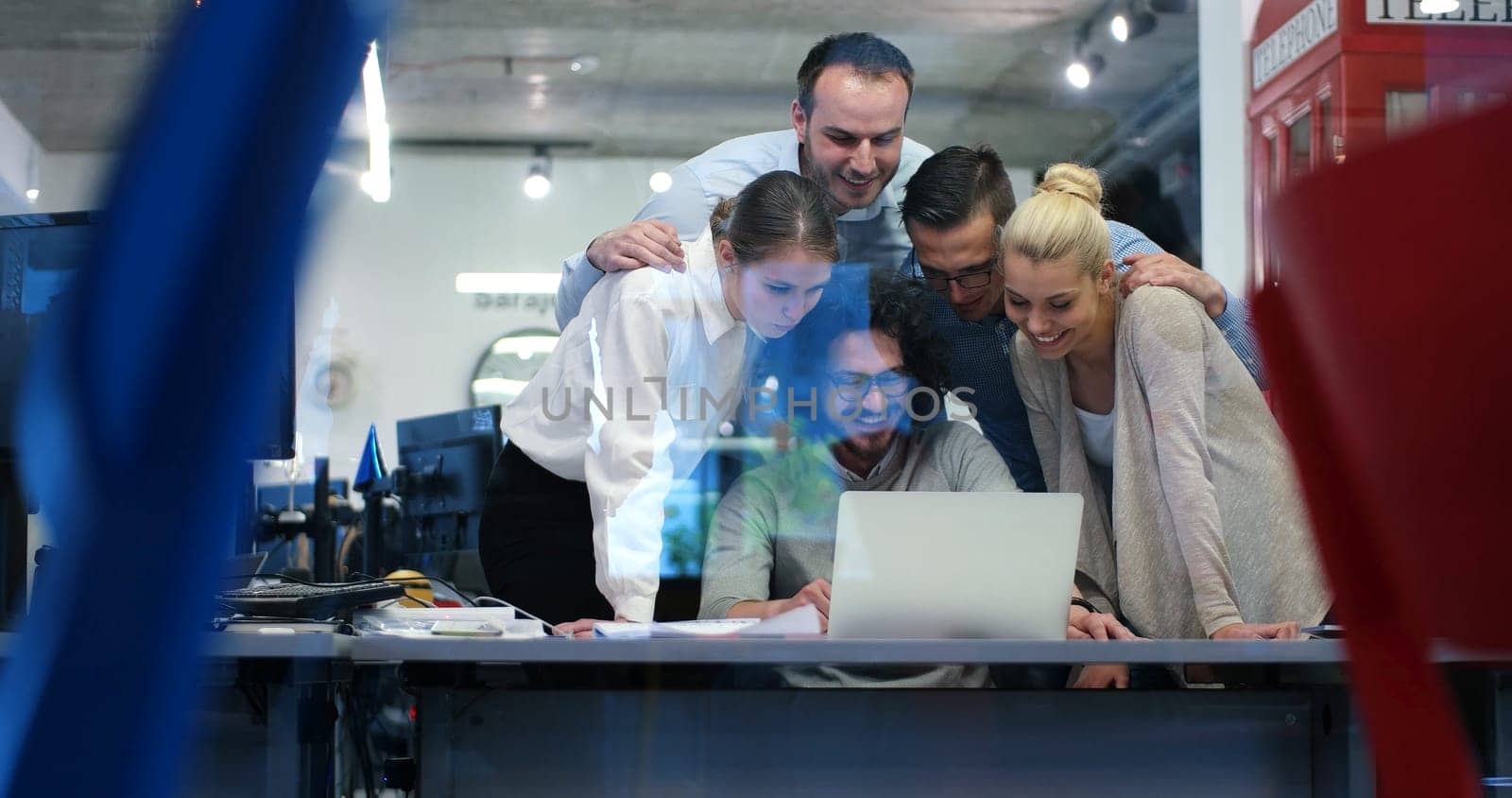 Group of a young business people discussing business plan at modern startup office building