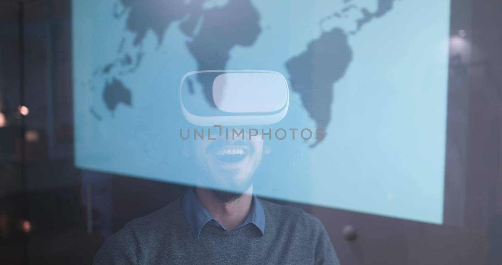 happy man getting experience using VR-headset glasses of virtual reality at home