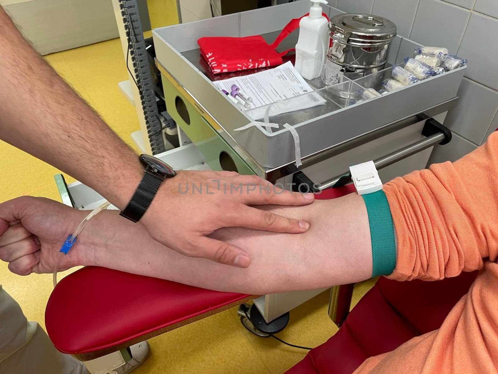 Close up nurse hand collecting blood sample for diagnosis covid-19, Coronavirus.Laboratory technician taking blood for blood chemistry diagnosis by automatic machine. High quality photo