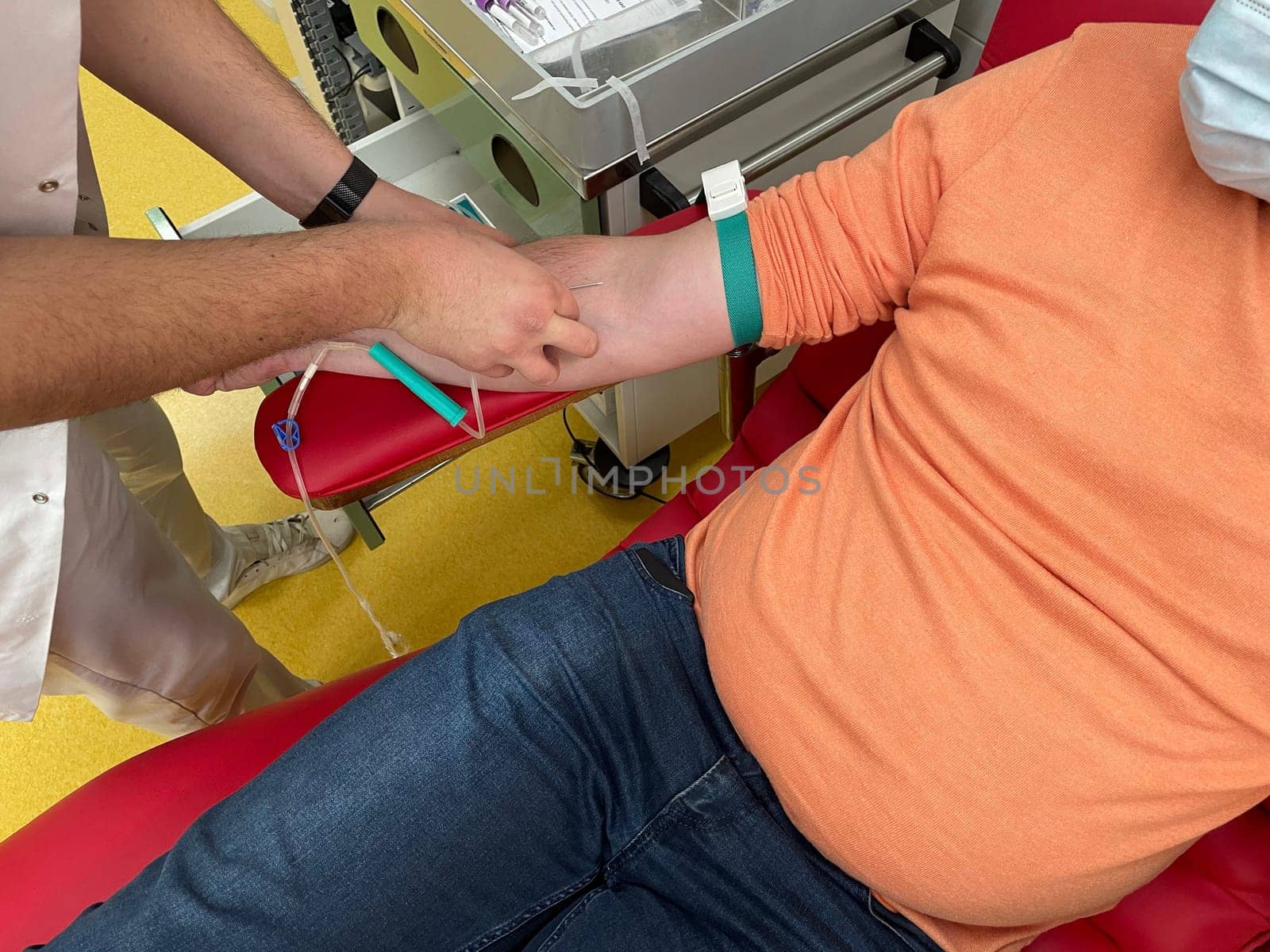 Close up nurse hand collecting blood sample for diagnosis covid-19, Coronavirus.Laboratory technician taking blood for blood chemistry diagnosis by automatic machine. High quality photo