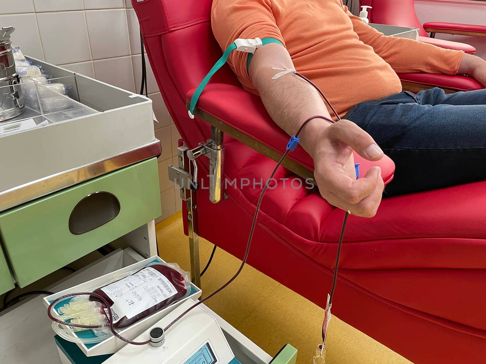 Close up nurse hand collecting blood sample for diagnosis covid-19, Coronavirus.Laboratory technician taking blood for blood chemistry diagnosis by automatic machine. High quality photo