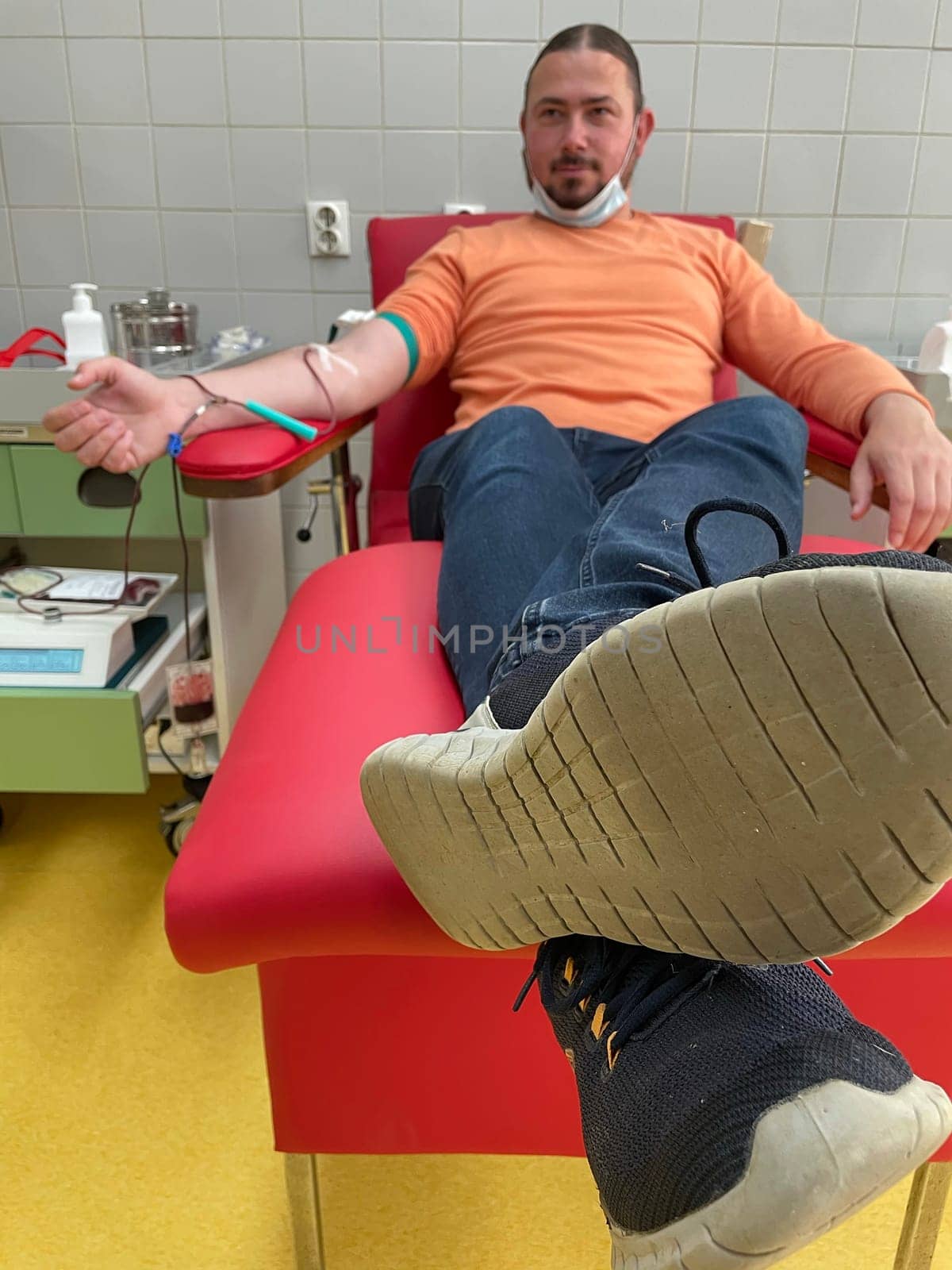 Close up nurse hand collecting blood sample for diagnosis covid-19, Coronavirus.Laboratory technician taking blood for blood chemistry diagnosis by automatic machine. High quality photo