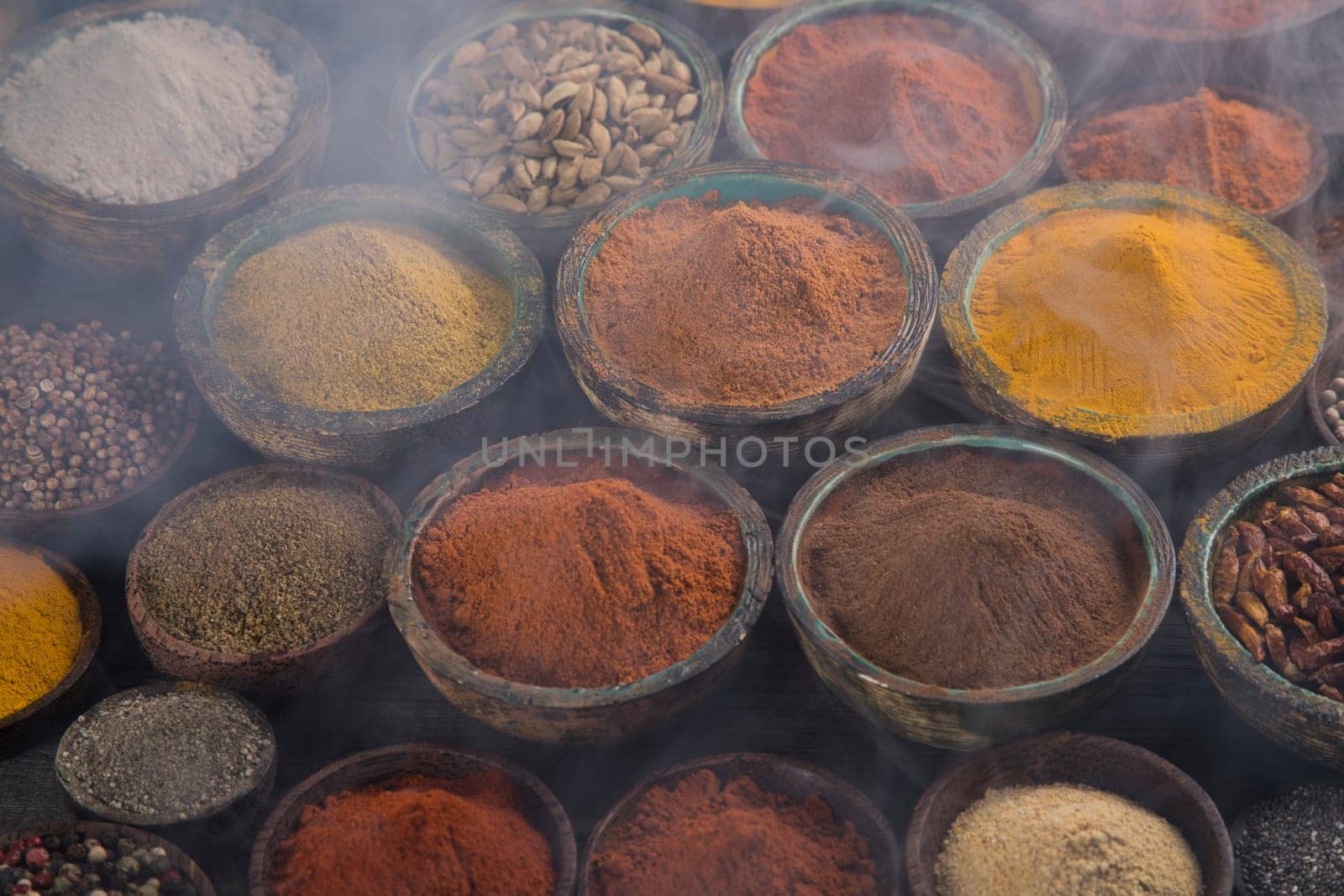 Smoke, Aromatic spices on wooden background
