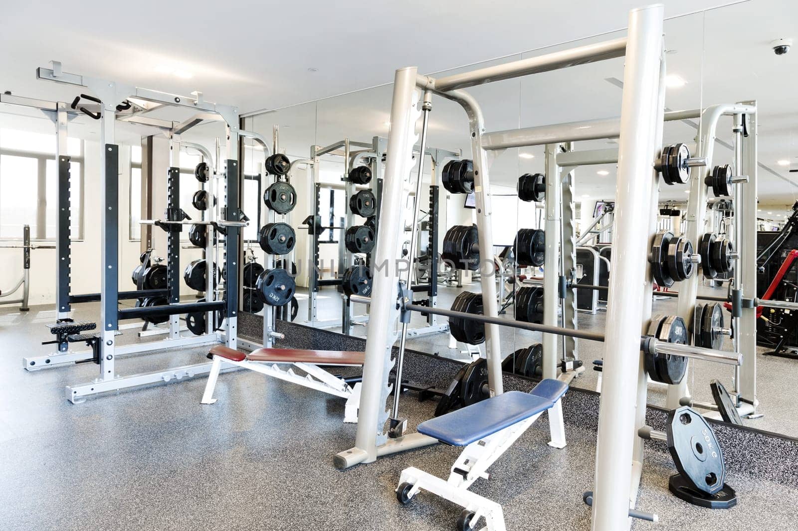 Weight lifting equipments in a club gym.
