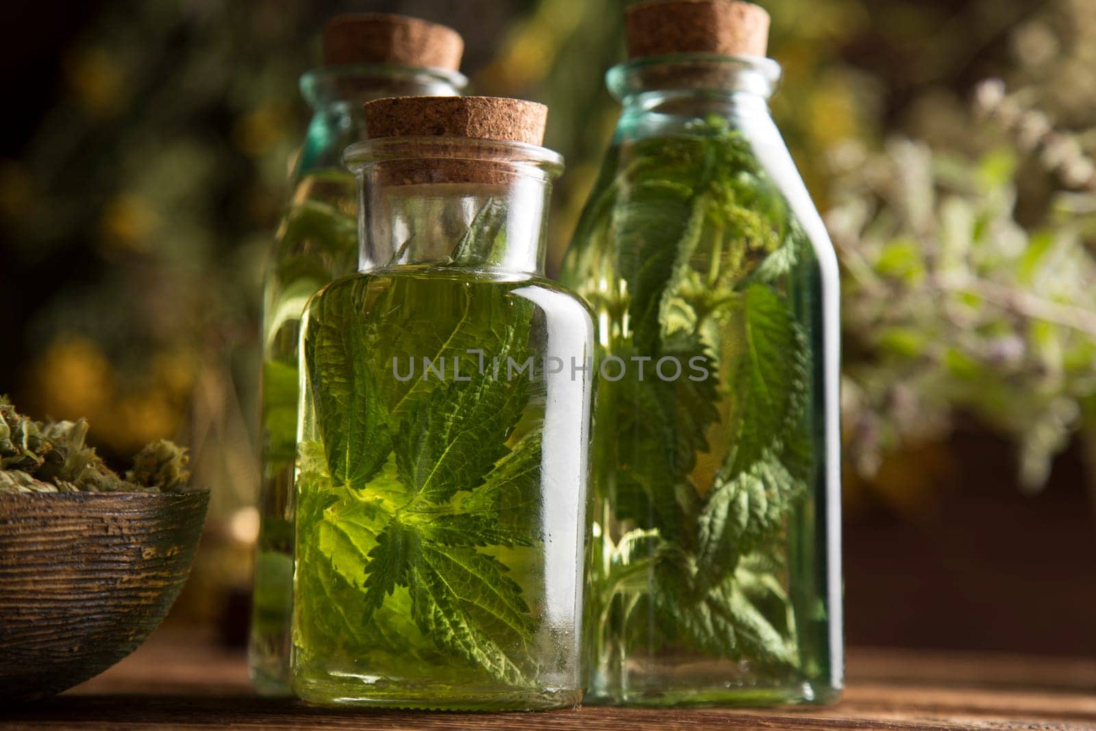 Oil and Natural medicine, wooden table background