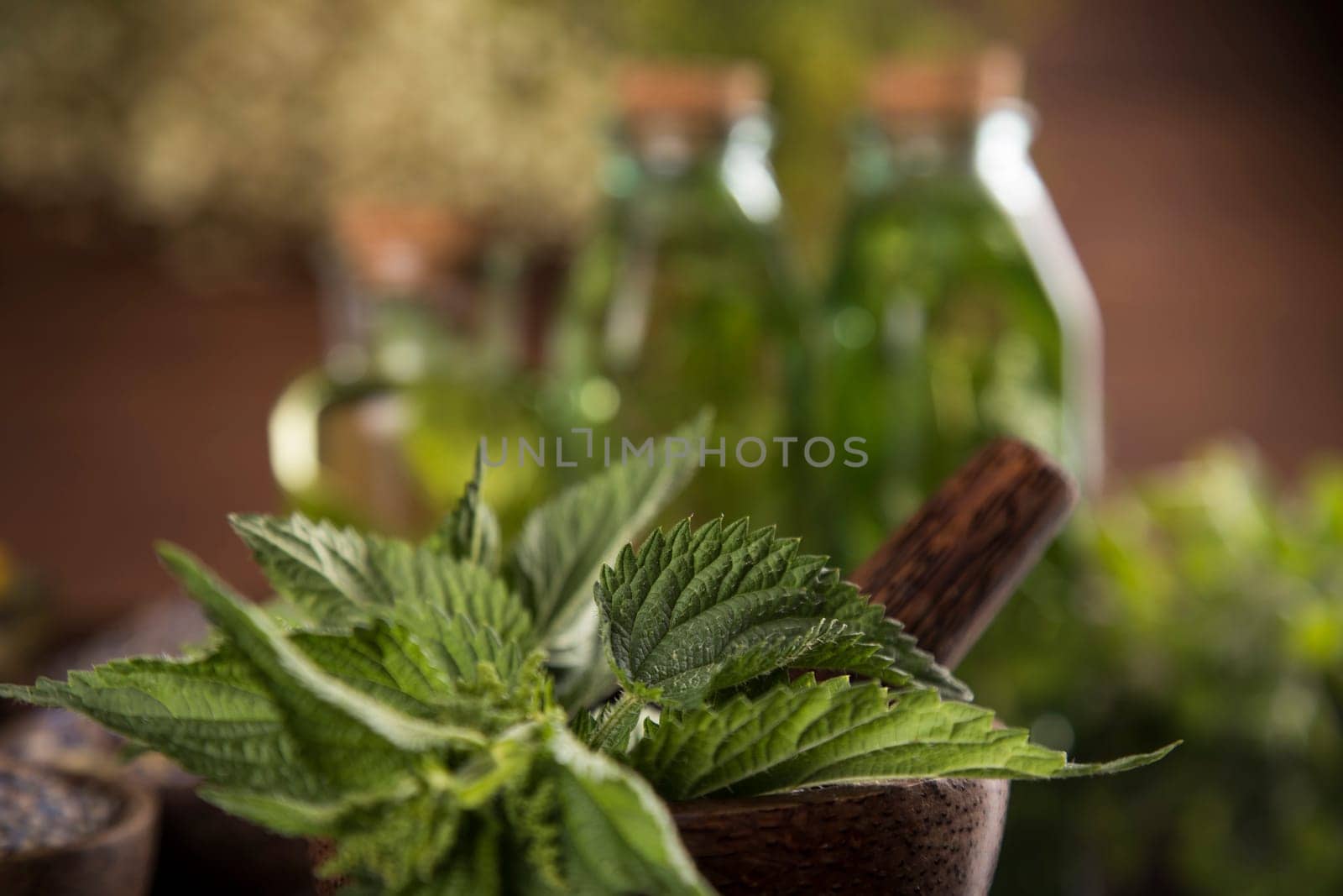 Oil and Natural medicine, wooden table background