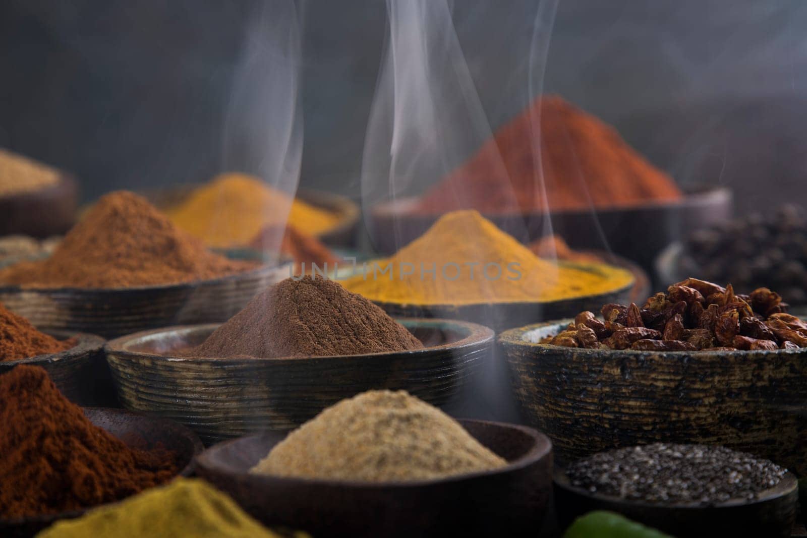 Assorted Spices and wooden bowl of smoke