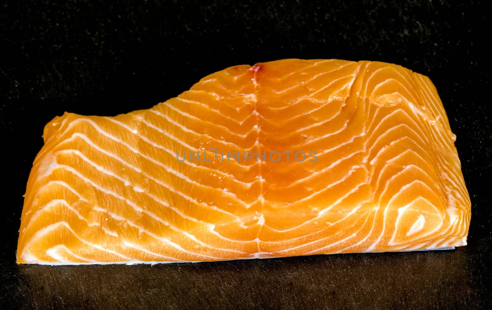Smoked salmon fish on a slate board. Tasty smoked fillet of red fish