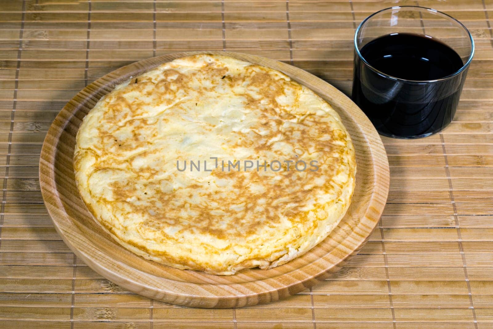A triangle of potato Spanish omelette on a plate