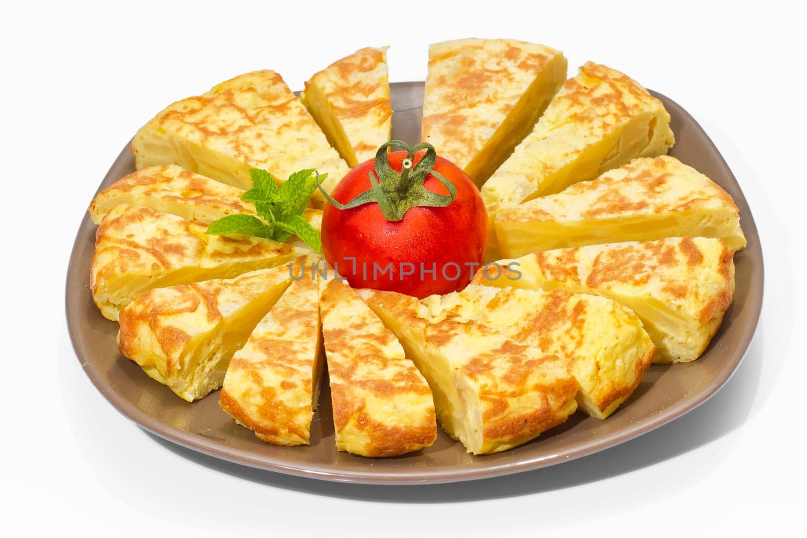 A triangle of potato Spanish omelette on a plate