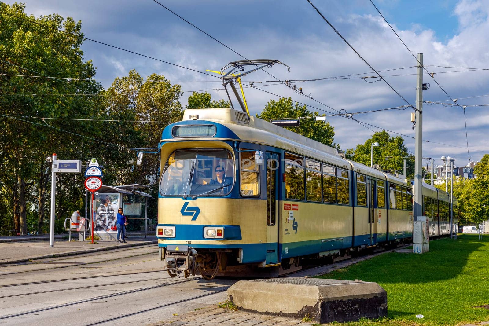 Vienna, Austria - September 16, 2019: people in streetcar in the Hofburg - with history dating back to mid-19th century. It is located in centre of Vienna
