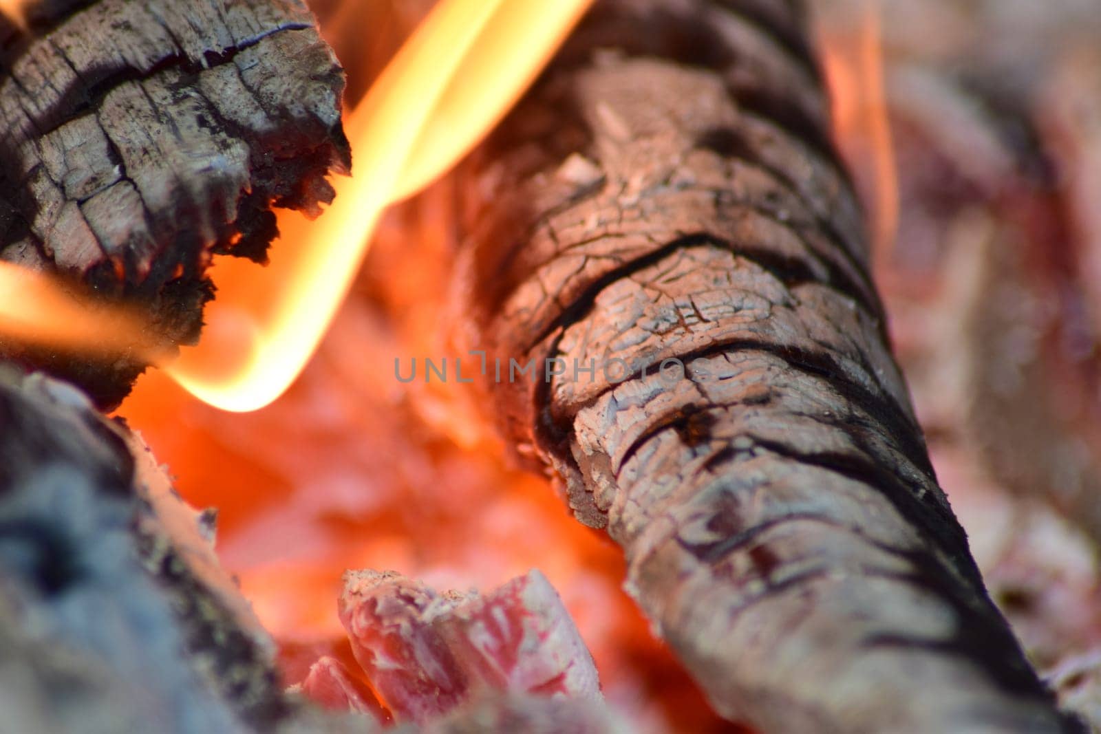 Hot coals in the stove. Red burned by heating the particles tree.
