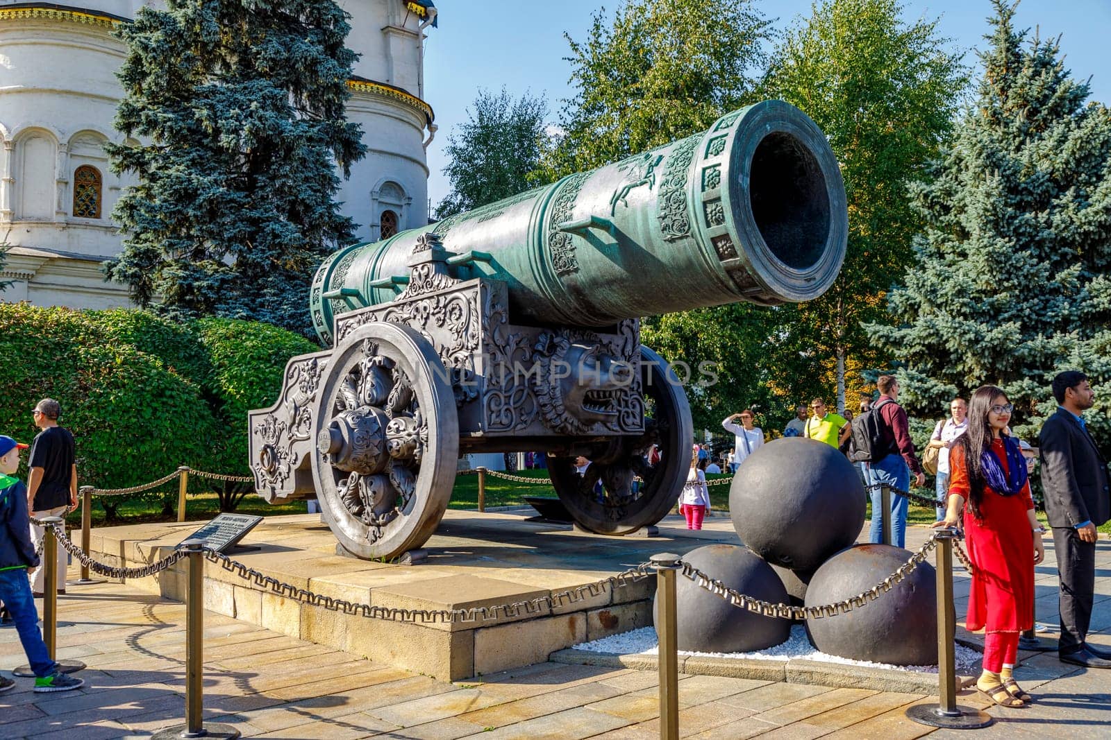 Moscow -August 15, 2018: Tourists are photographed near the Tsar Cannon (King Cannon) in Moscow Kremlin in winter. UNESCO World Heritage Site.