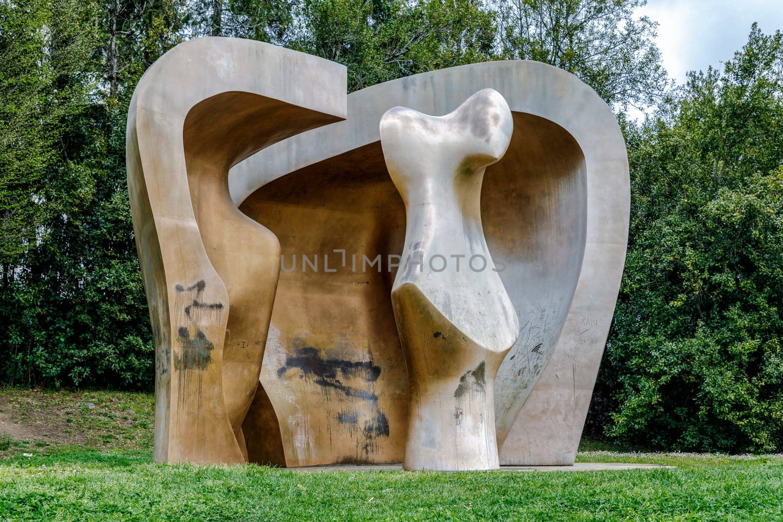 Guernica, Spain - April 09, 2018: Sculpture by Henry Moore "Large Figure in a shelter"". Brought to Gernika in 1991. This sculpture is part of the ""War Helmets"" collection that the artist started during the Second World War"
