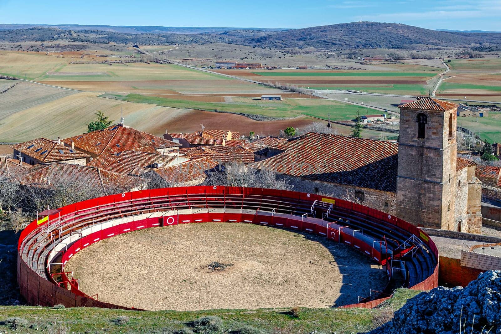 Bullring next to Holy Trinity Church and a view over Atienza town, Guadalajara, Spain