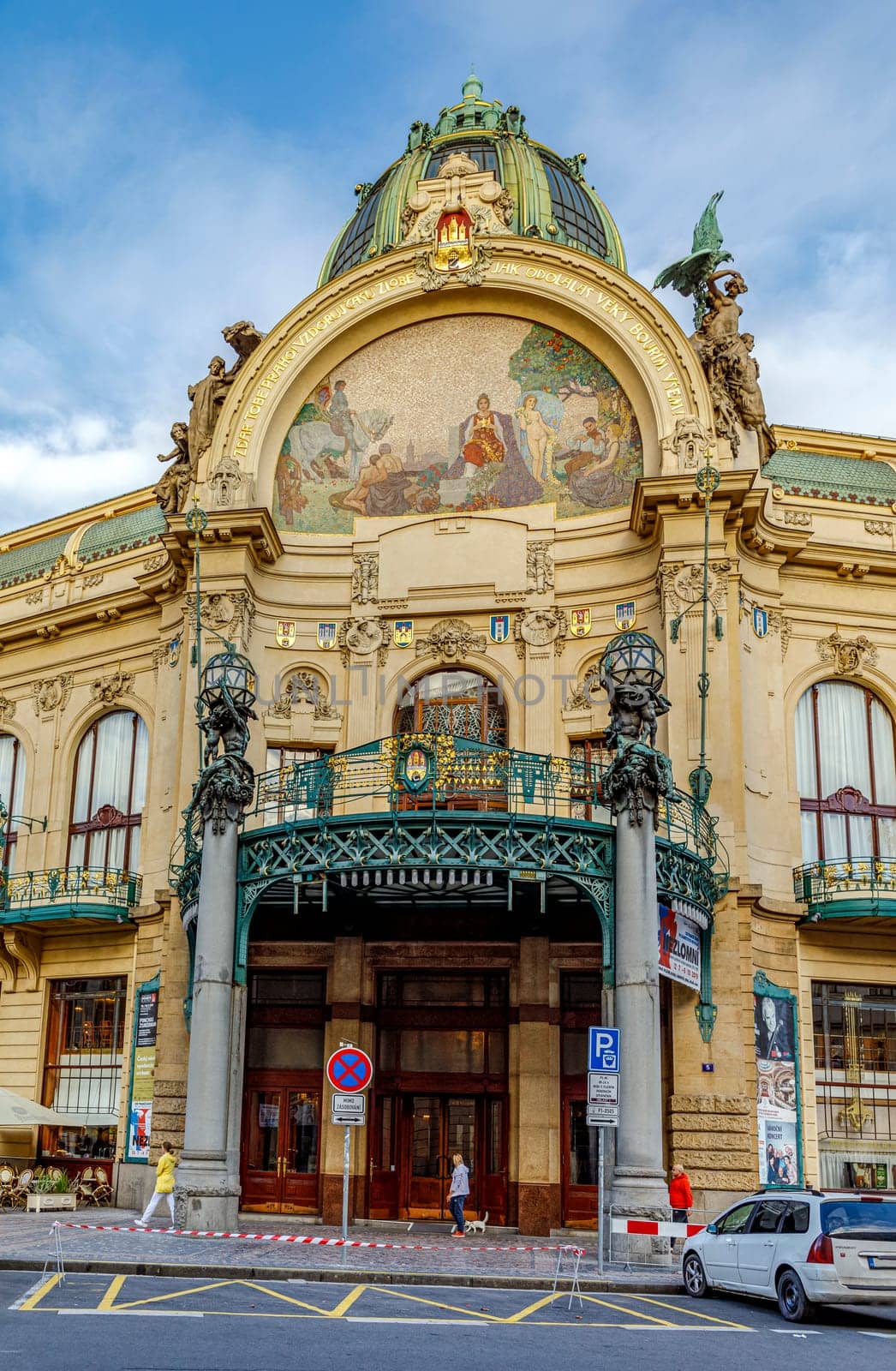 Prague, Czech republic - September 12, 2019: The Art Nouveau building Municipal House in Prague with gold trimmings, stained glass and sculpture