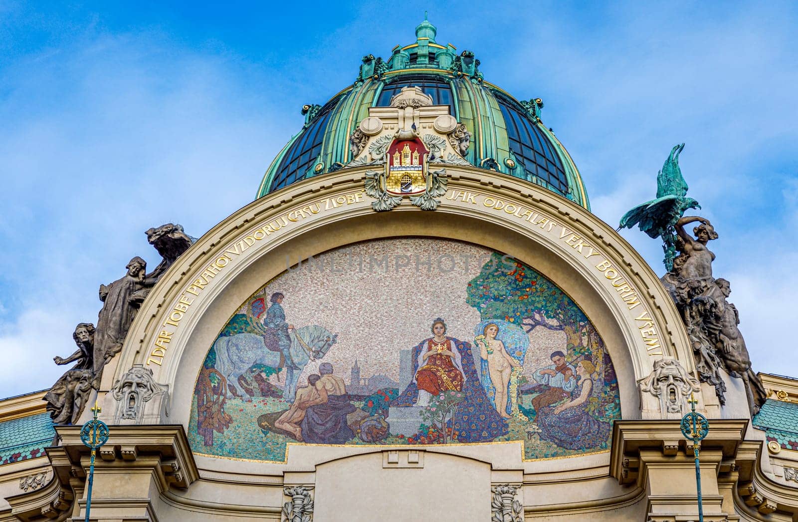 Prague, Czech republic - September 12, 2019: The Art Nouveau building Municipal House in Prague with gold trimmings, stained glass and sculpture