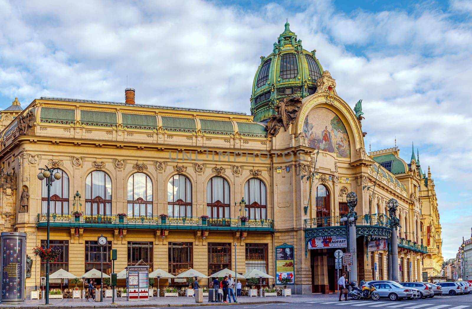 Prague, Czech republic - September 12, 2019: The Art Nouveau building Municipal House in Prague with gold trimmings, stained glass and sculpture