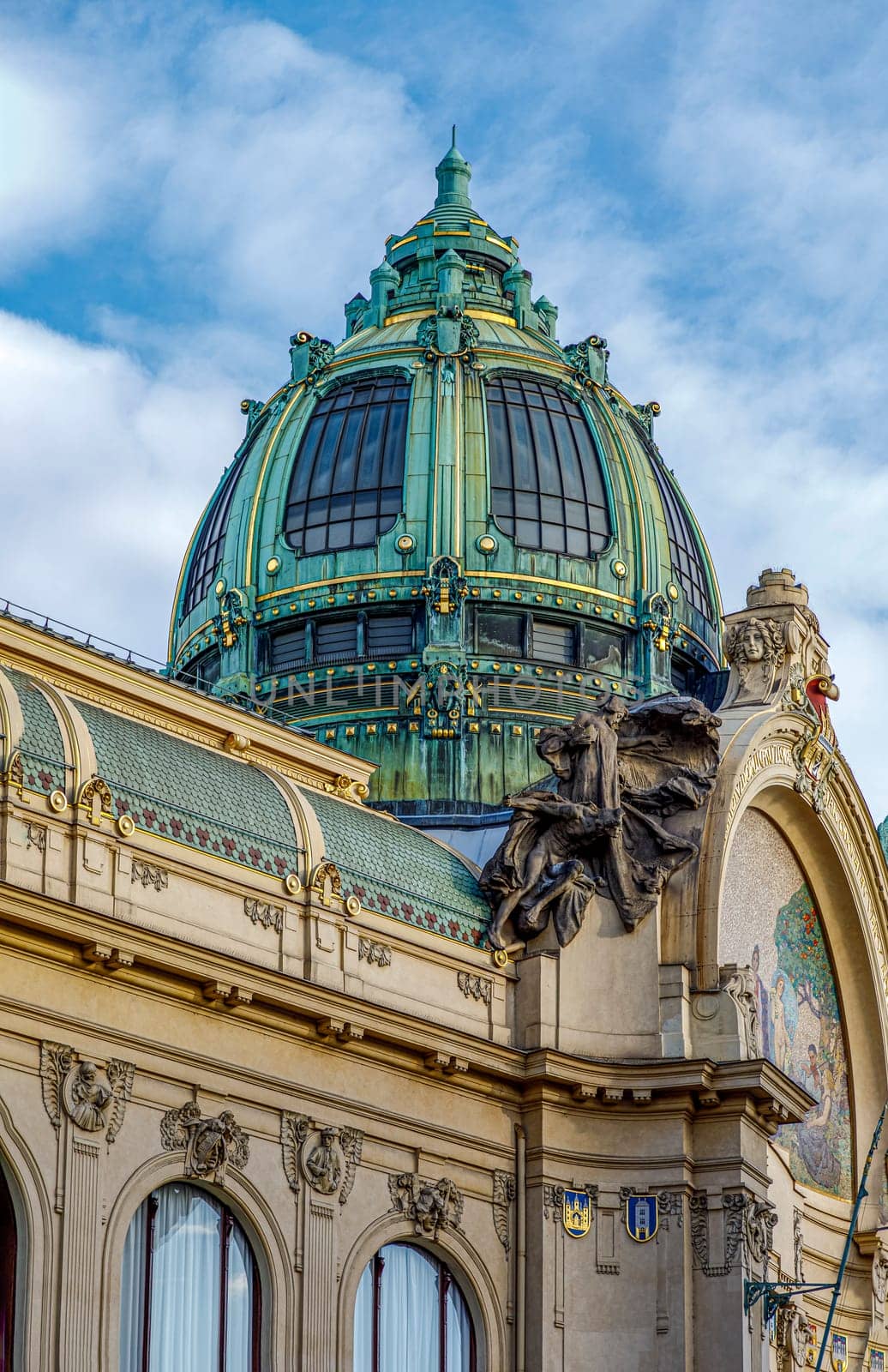 Prague, Czech republic - September 12, 2019: The Art Nouveau building Municipal House in Prague with gold trimmings, stained glass and sculpture