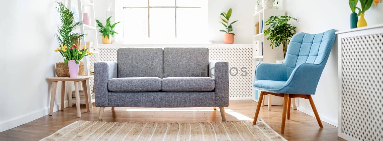 Living room with white walls and colourful furniture. Apartment in Scandinavian style.