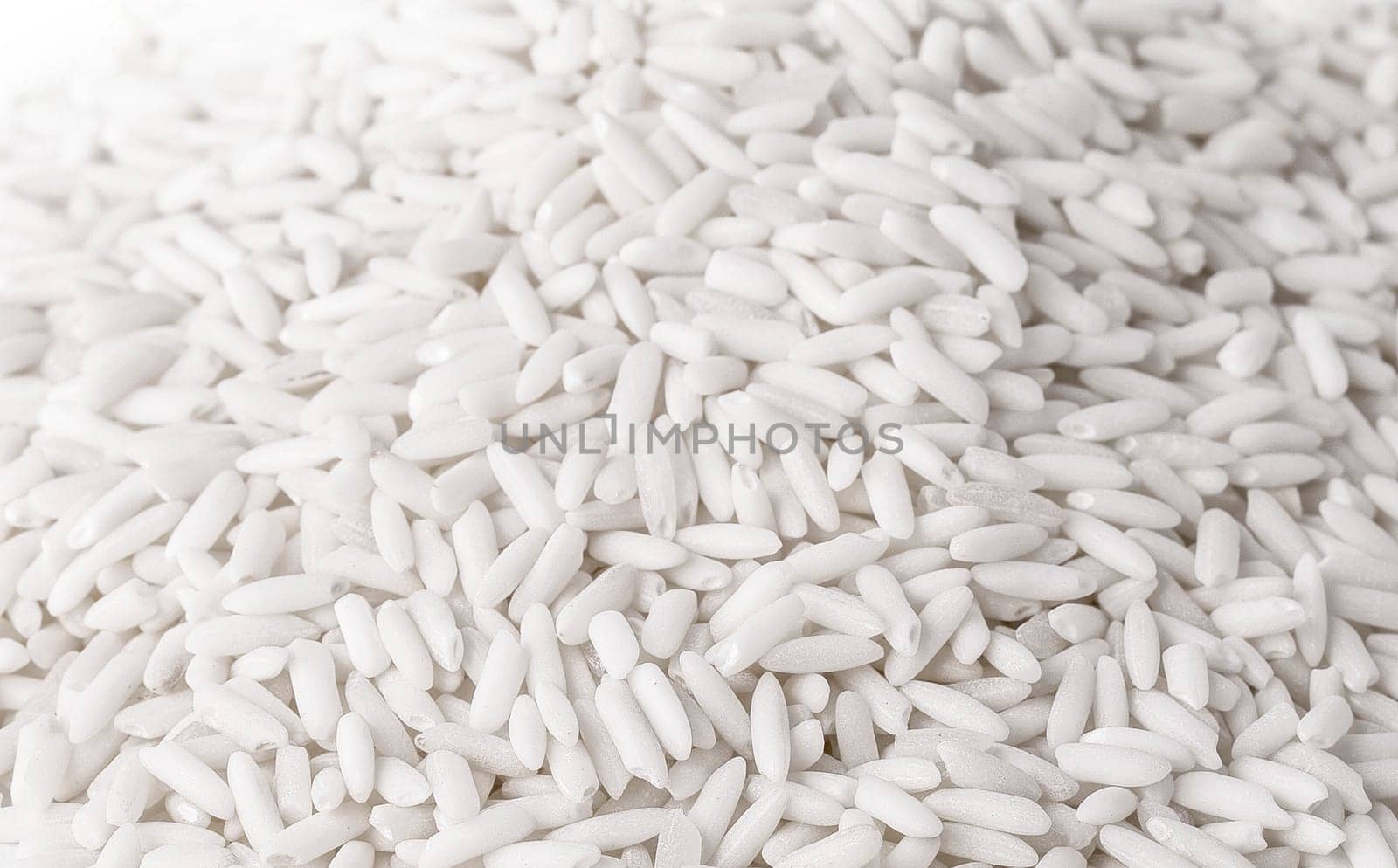 The close up white rice isolated on a white background