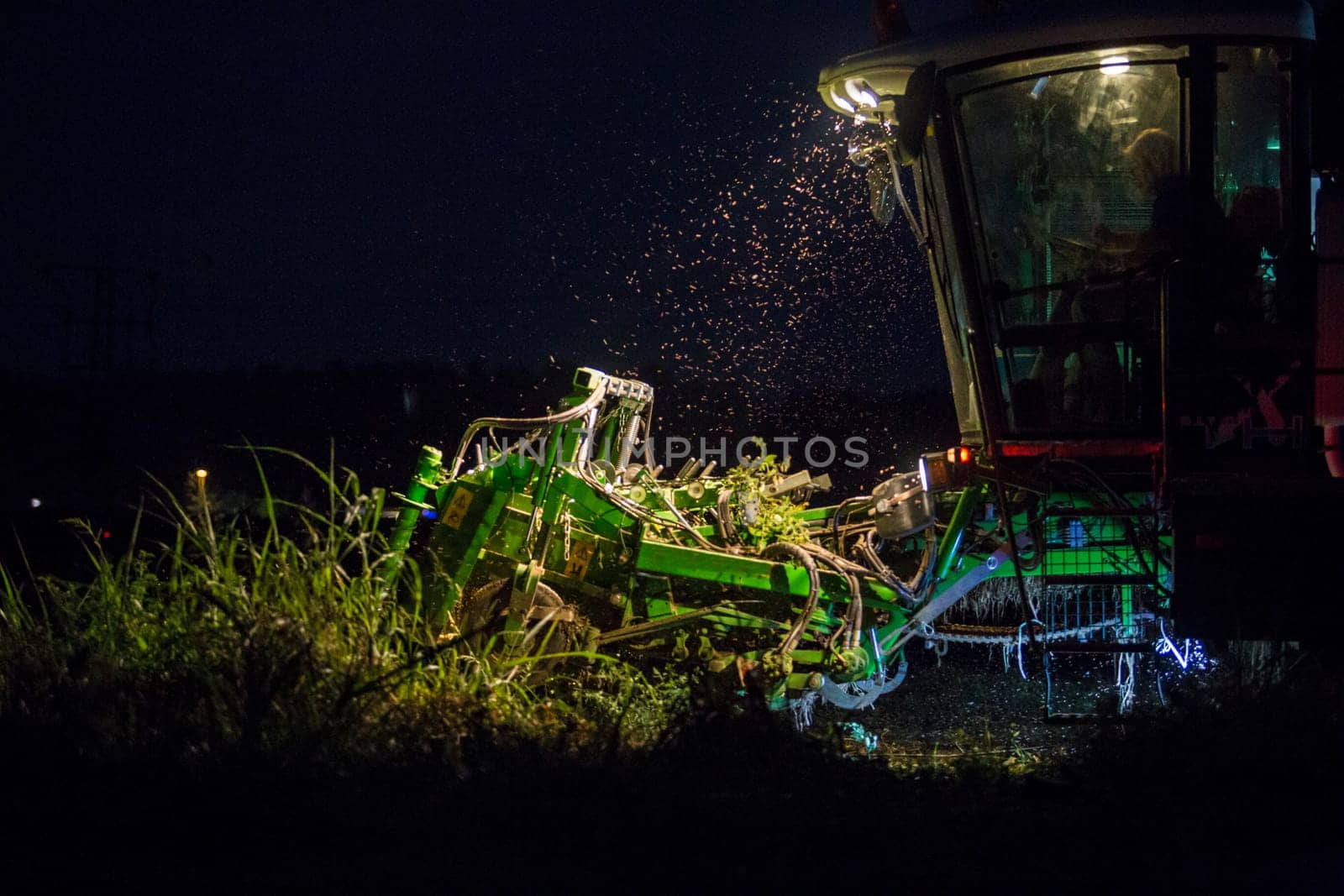 Tomato harvester working at night. Vegas Bajas del Guadiana, Spain