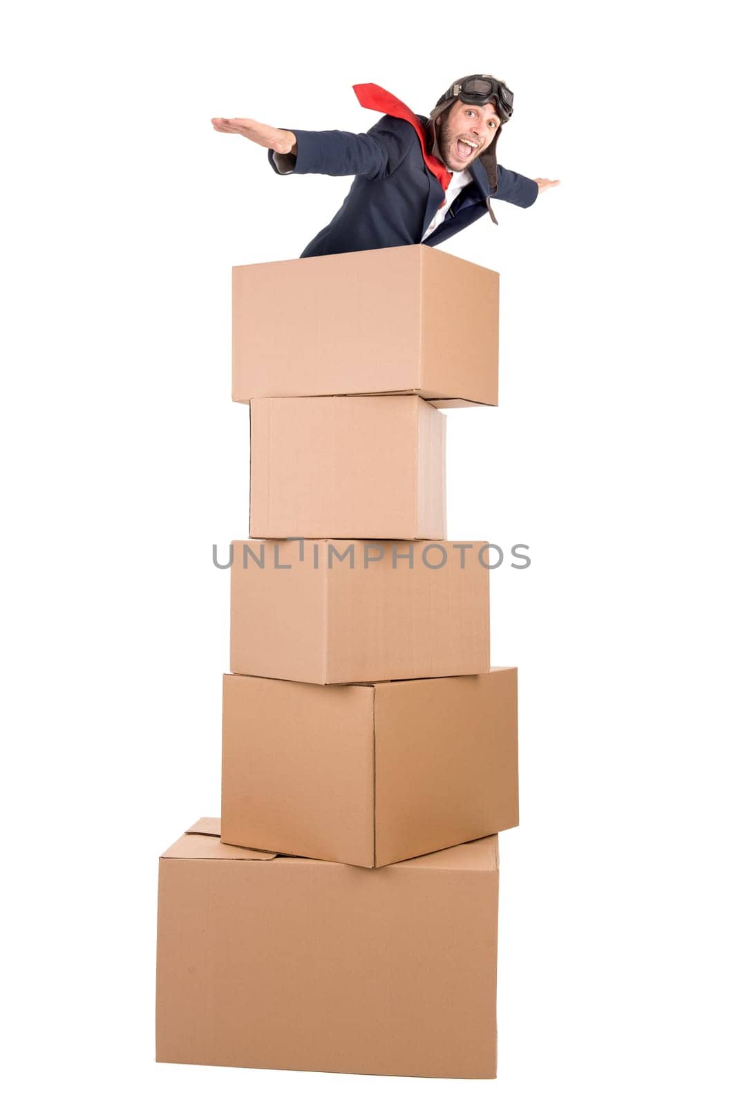 Businessman flying in carboard boxes isolated in white