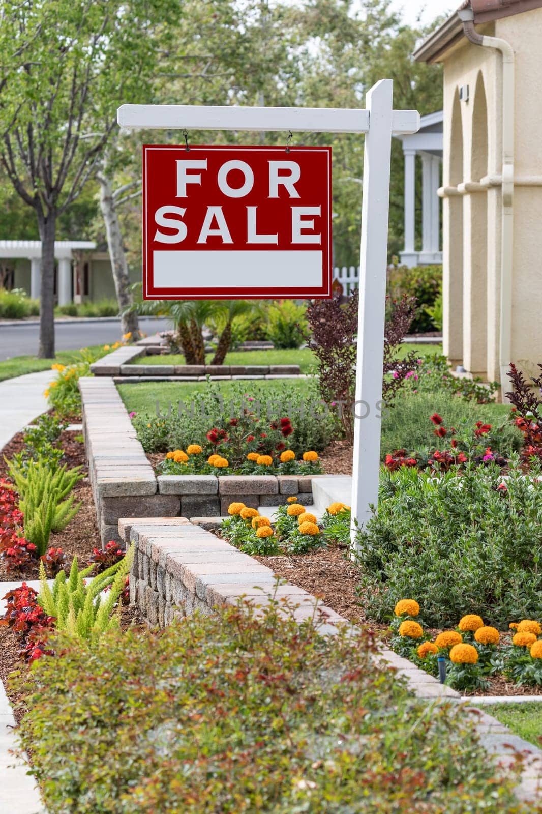 Home For Sale Real Estate Sign in Front of New House.