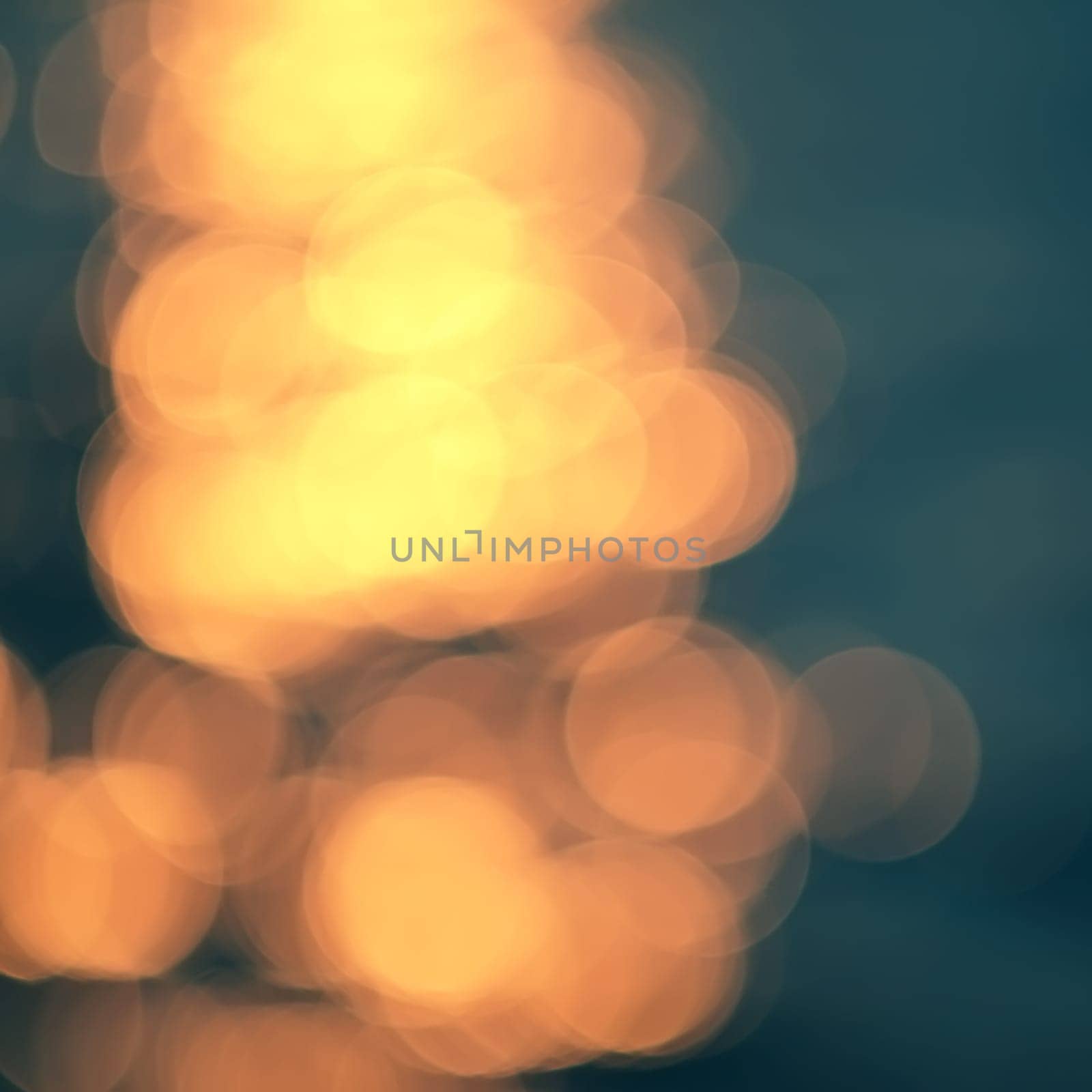 Golden sunlights on blue water background.