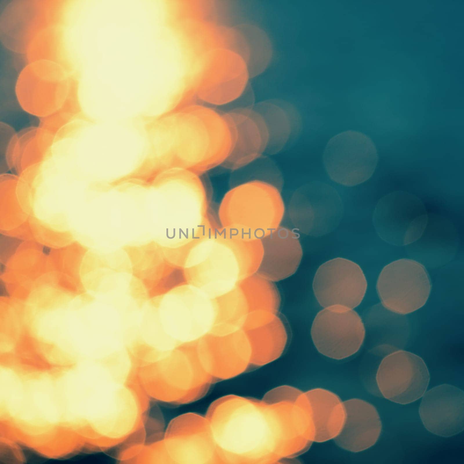 Golden sunlights on blue water background.