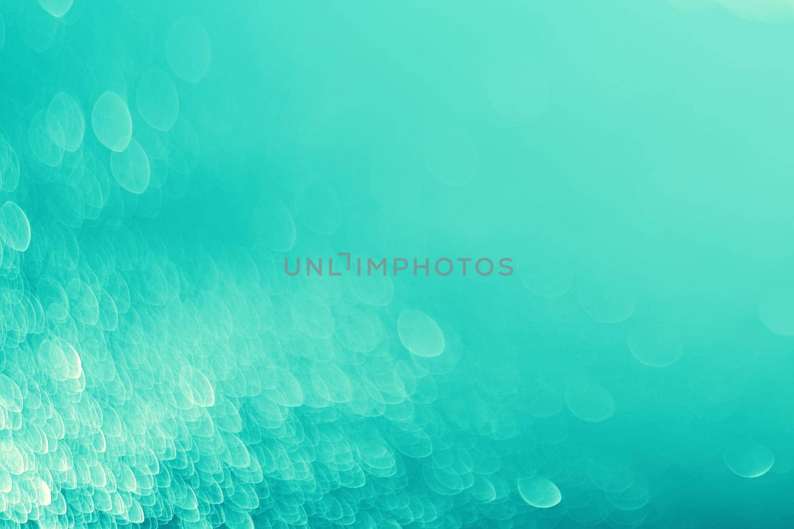 Lights on blue background.Underwater,bubbles.Vintage toned.