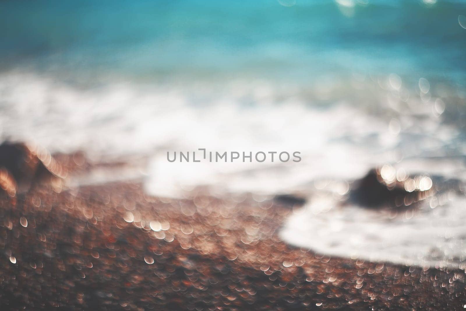 Water bokeh lights on the coastline.Natural background.