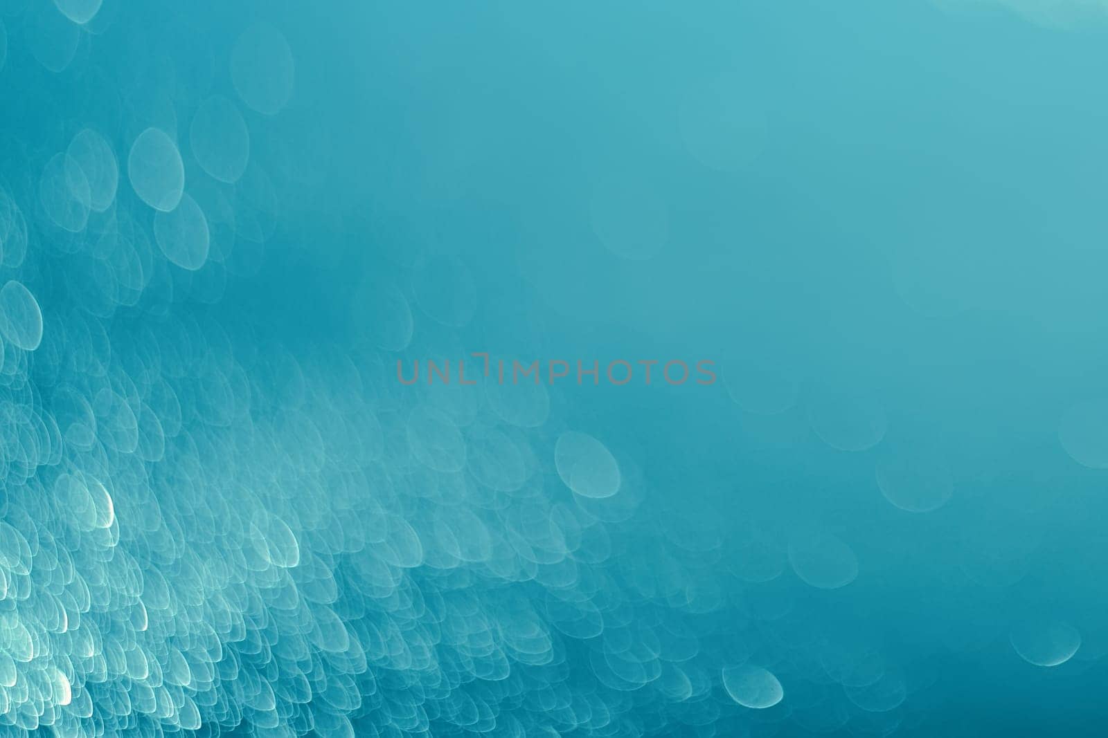 Lights on blue background.Underwater,bubbles.