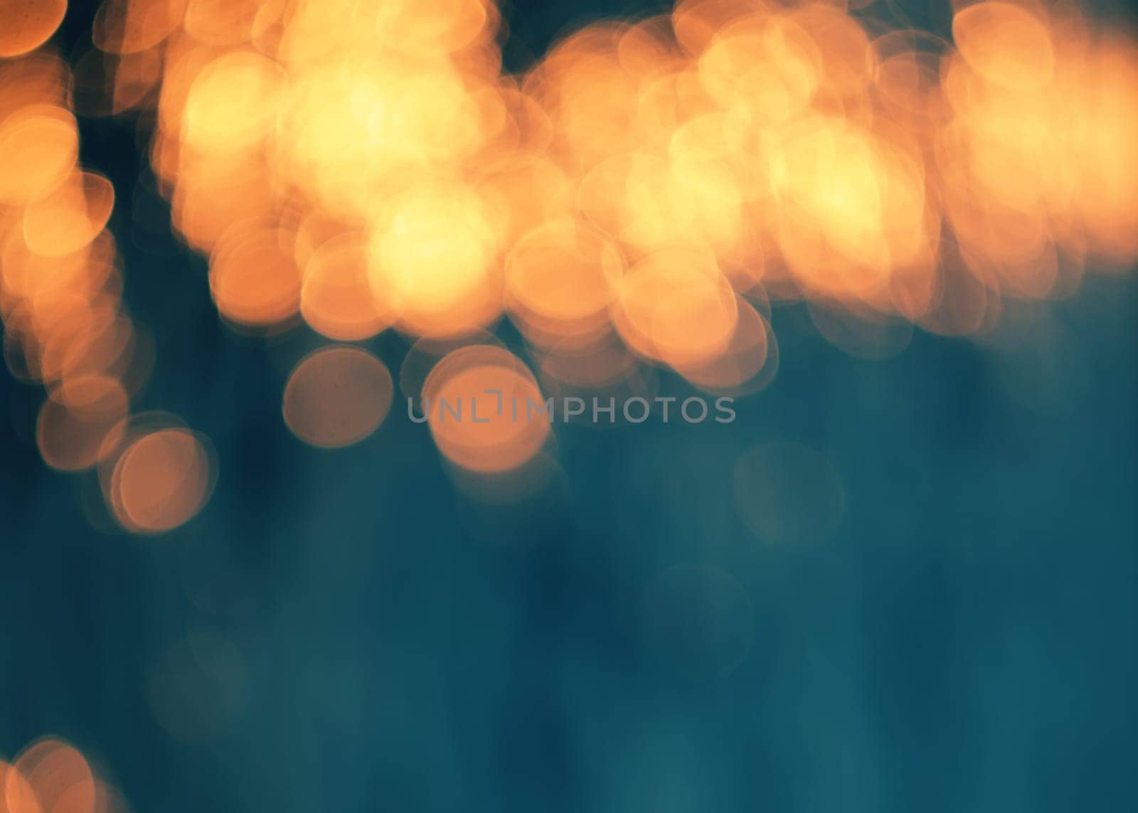 Blue bokeh background.Orange lights.