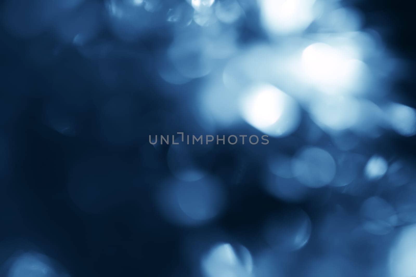 Lights on blue background.Underwater.