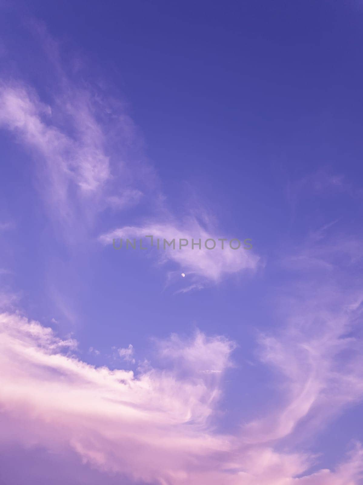 Tranquil evening cloudscape scene over the blue sky. Fluffy white clouds aerial composition. Misty overcast cumulus shapes, abstract nebula textures. Air fresheners, celestial beauty, vertical background