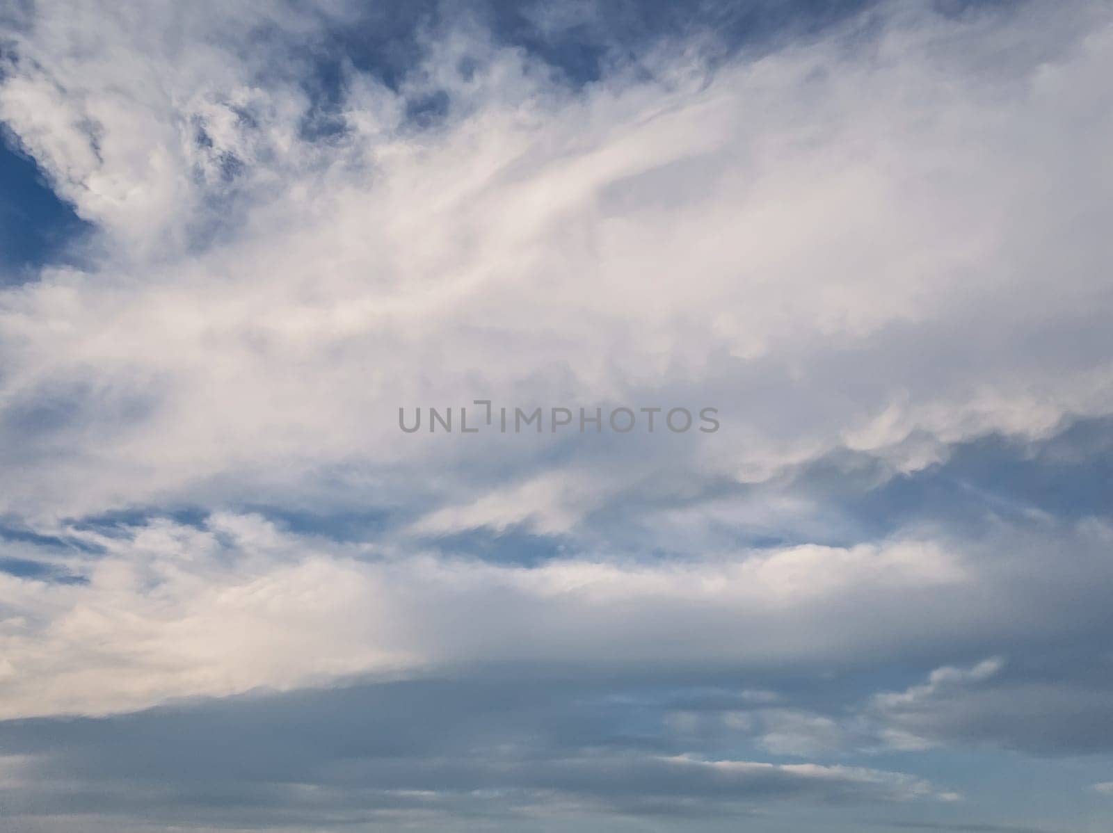 Tranquil cloudscape scene over the blue sky. Fluffy white clouds aerial composition. Misty overcast cumulus shapes, abstract nebula textures. Air fresheners, celestial beauty