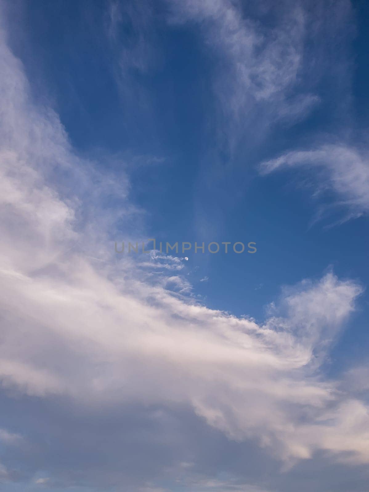 Panoramic cloudscape scene over the blue sky. Fluffy white clouds aerial composition. Misty overcast cumulus shapes, abstract nebula textures. Air fresheners, celestial beauty, vertical background