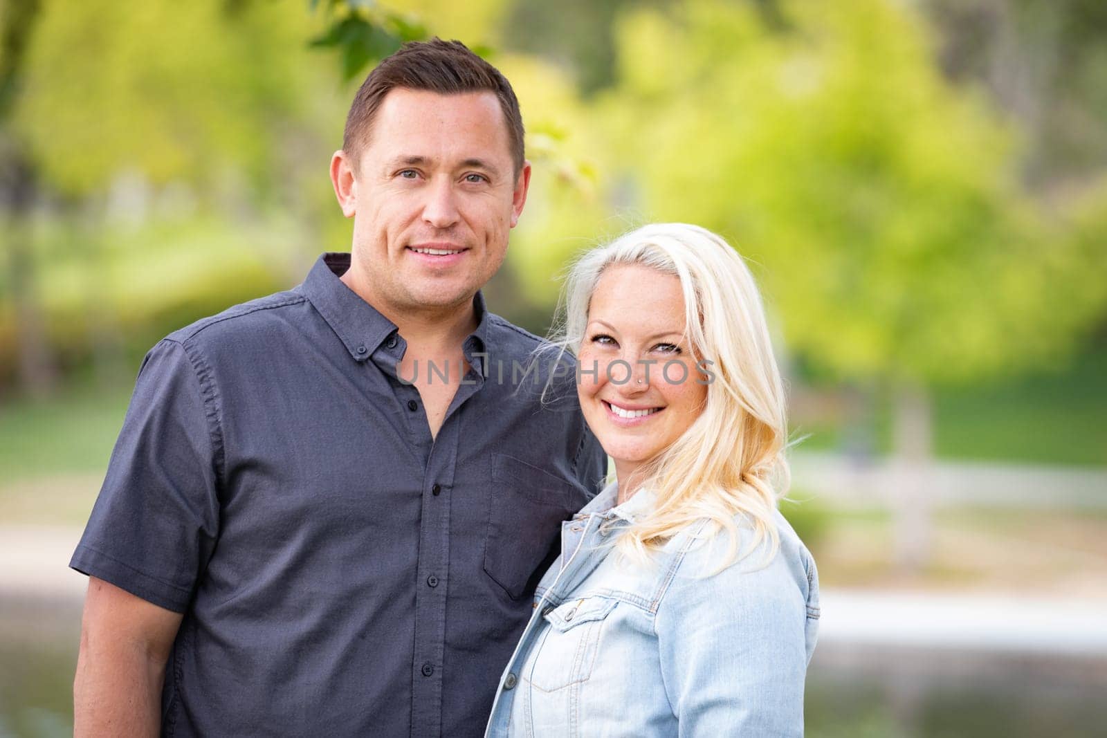 Young Caucasian Couple Portrait In The Park.