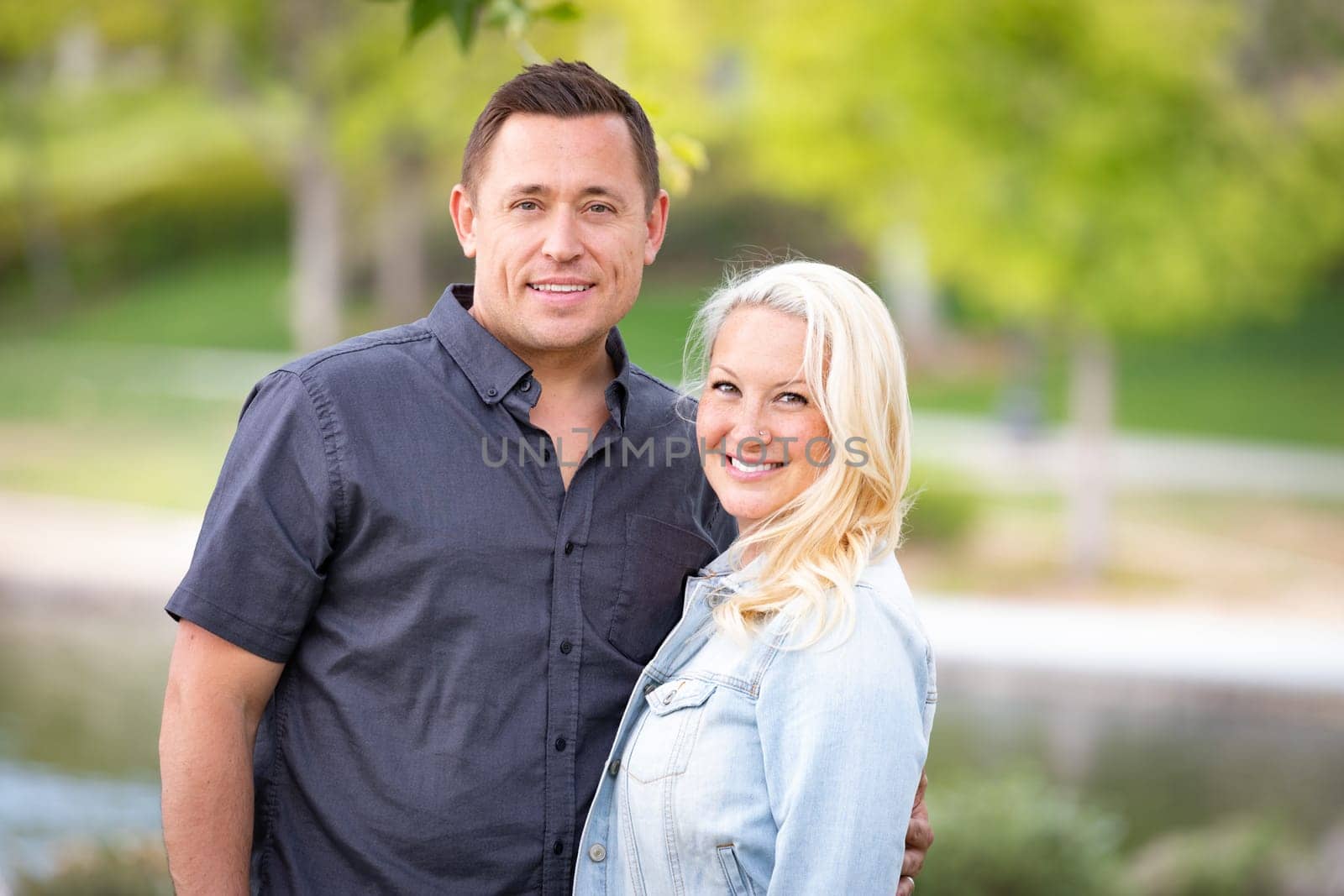 Young Caucasian Couple Portrait In The Park.