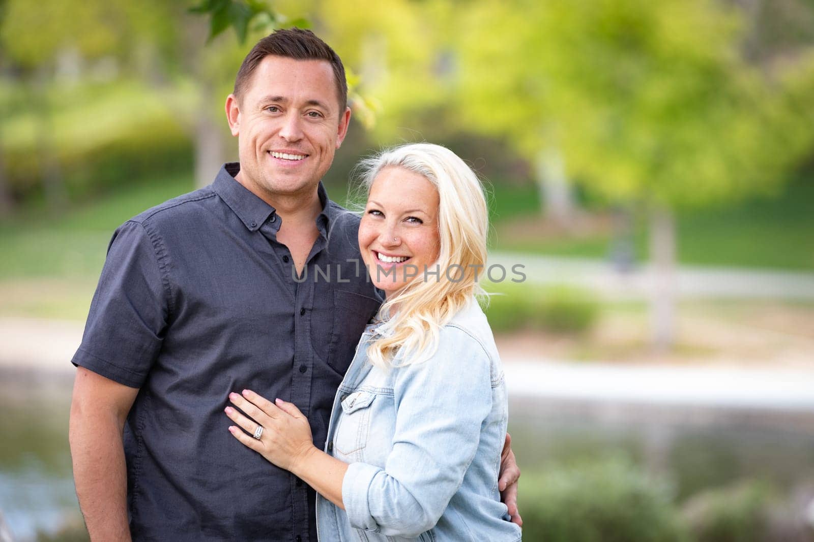 Young Caucasian Couple Portrait In The Park.