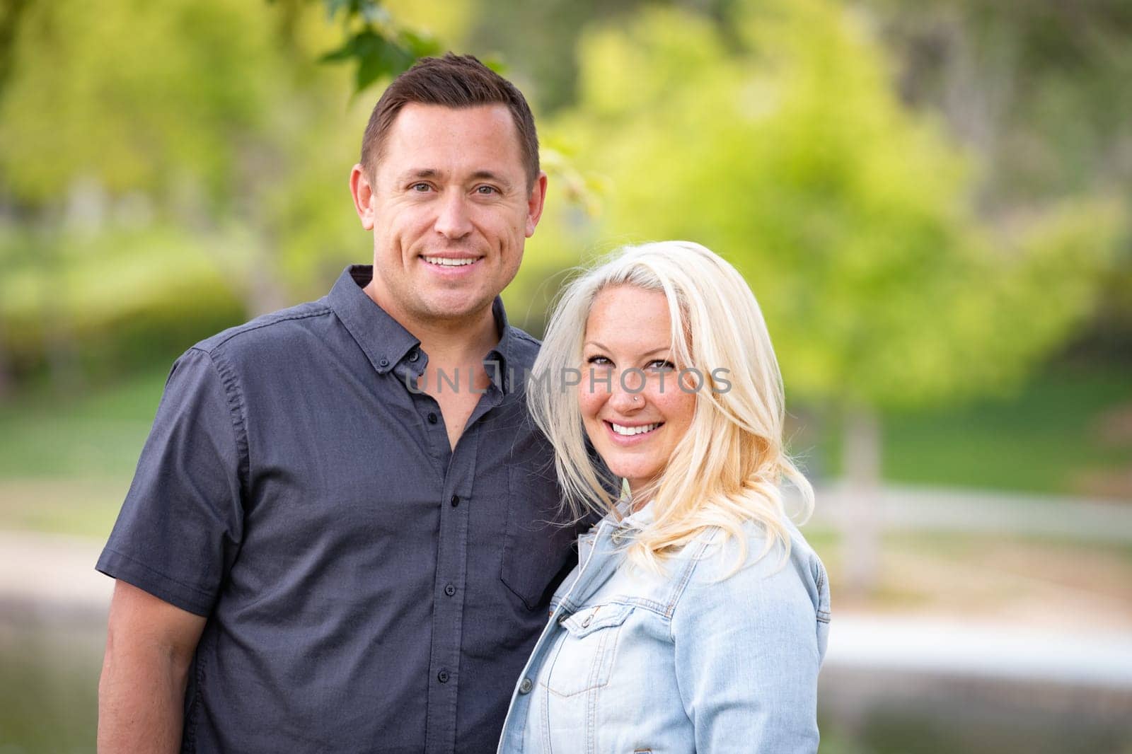 Young Caucasian Couple Portrait In The Park.