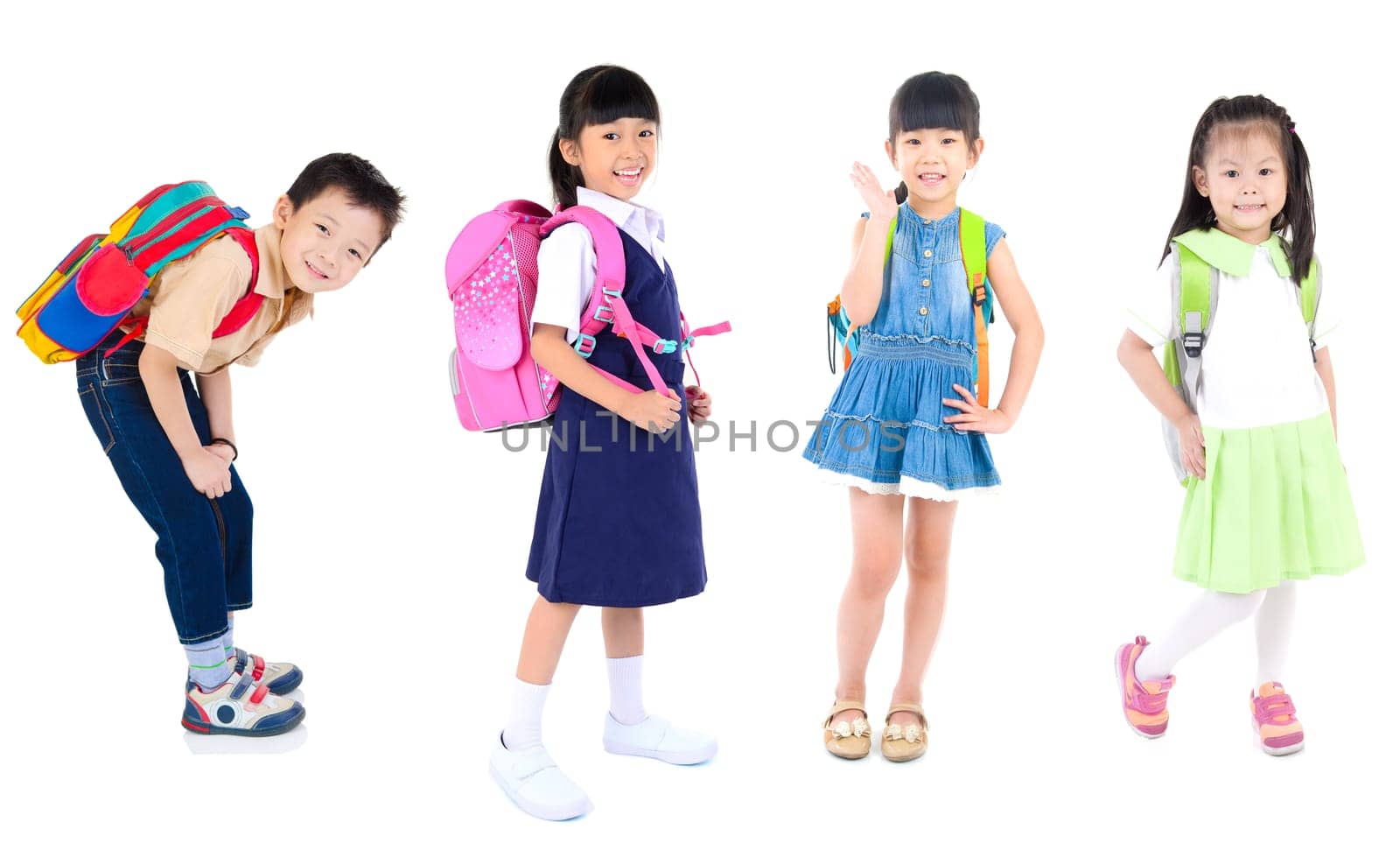 Portrait of happiness group of cute little child girls in uniform with school bag smiling  are back to school, isolated over white background.