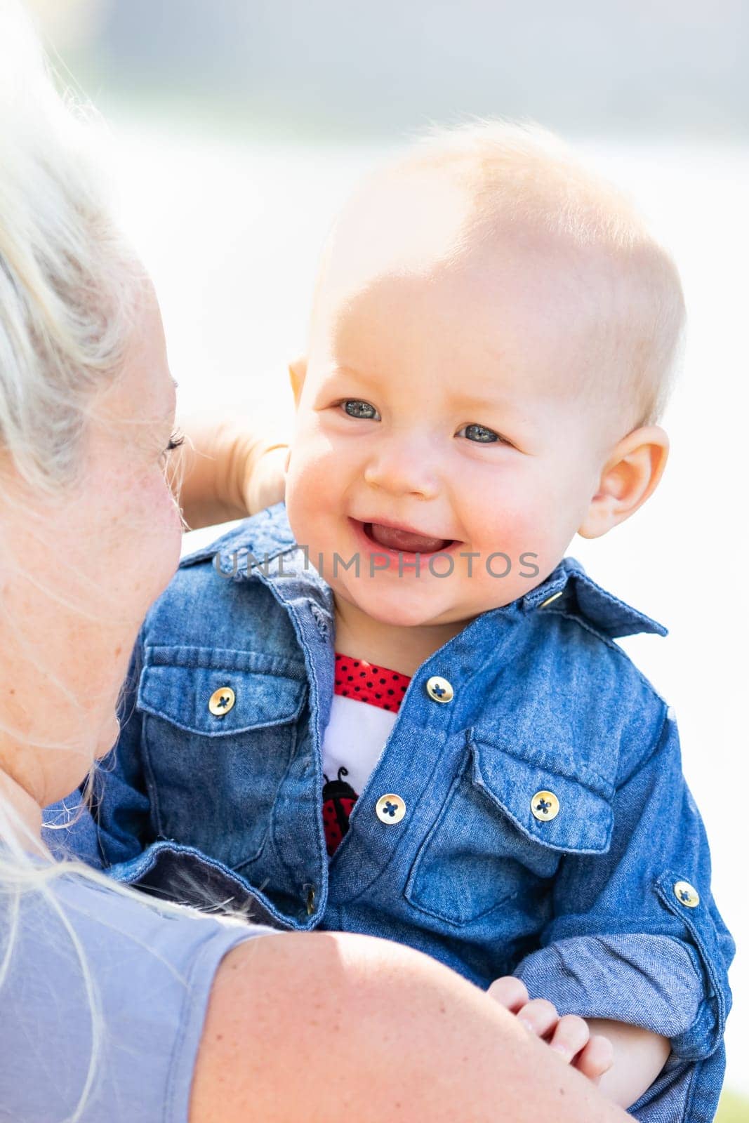 Young Caucasian Mother and Daughter At The Park.