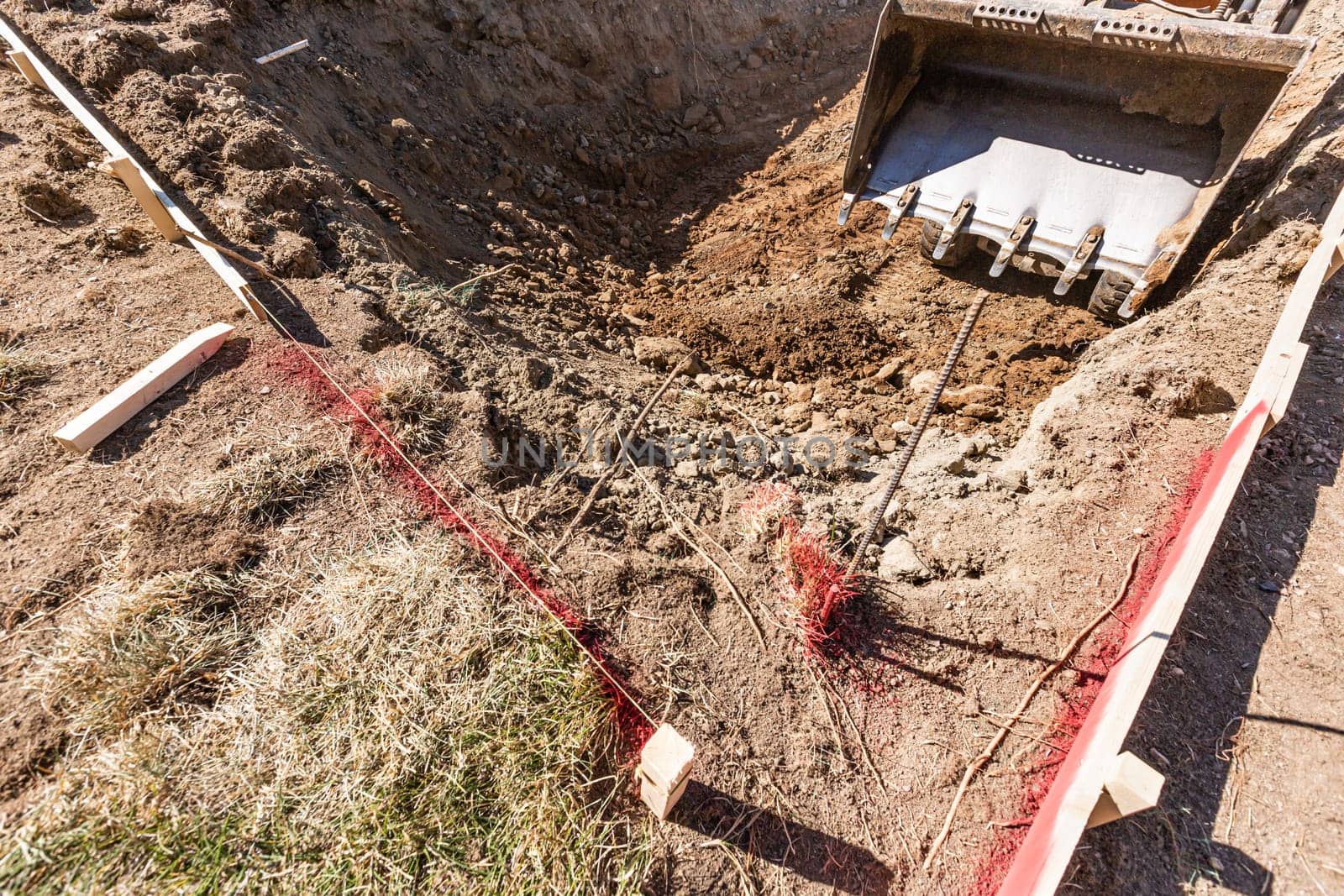 Small Bulldozer Digging In Yard For Pool Installation.
