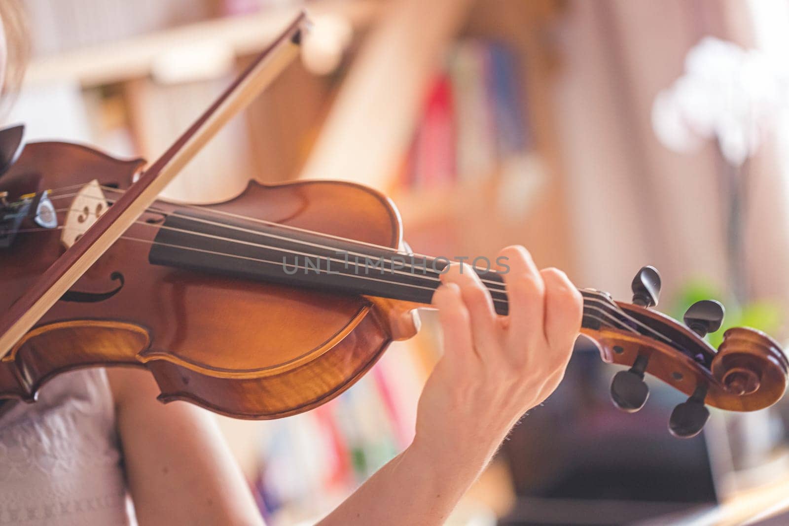 Young girl practices on her violin, acoustic music