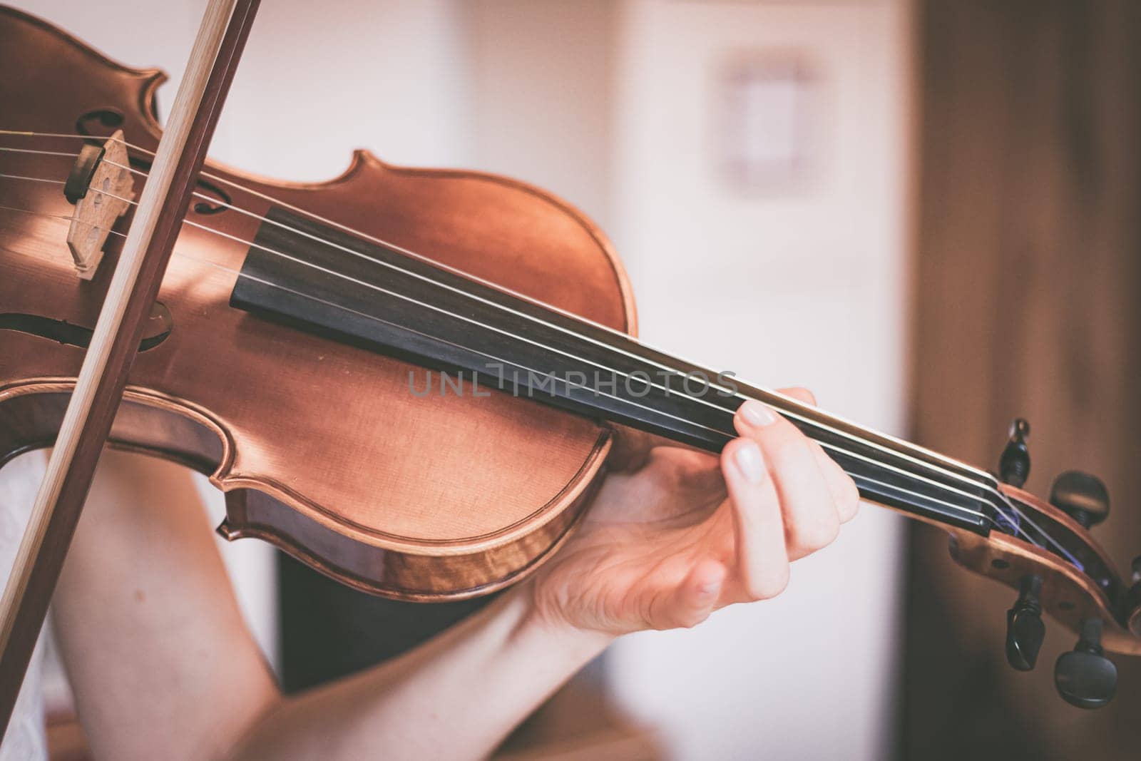 Young girl practices on her violin, acoustic music