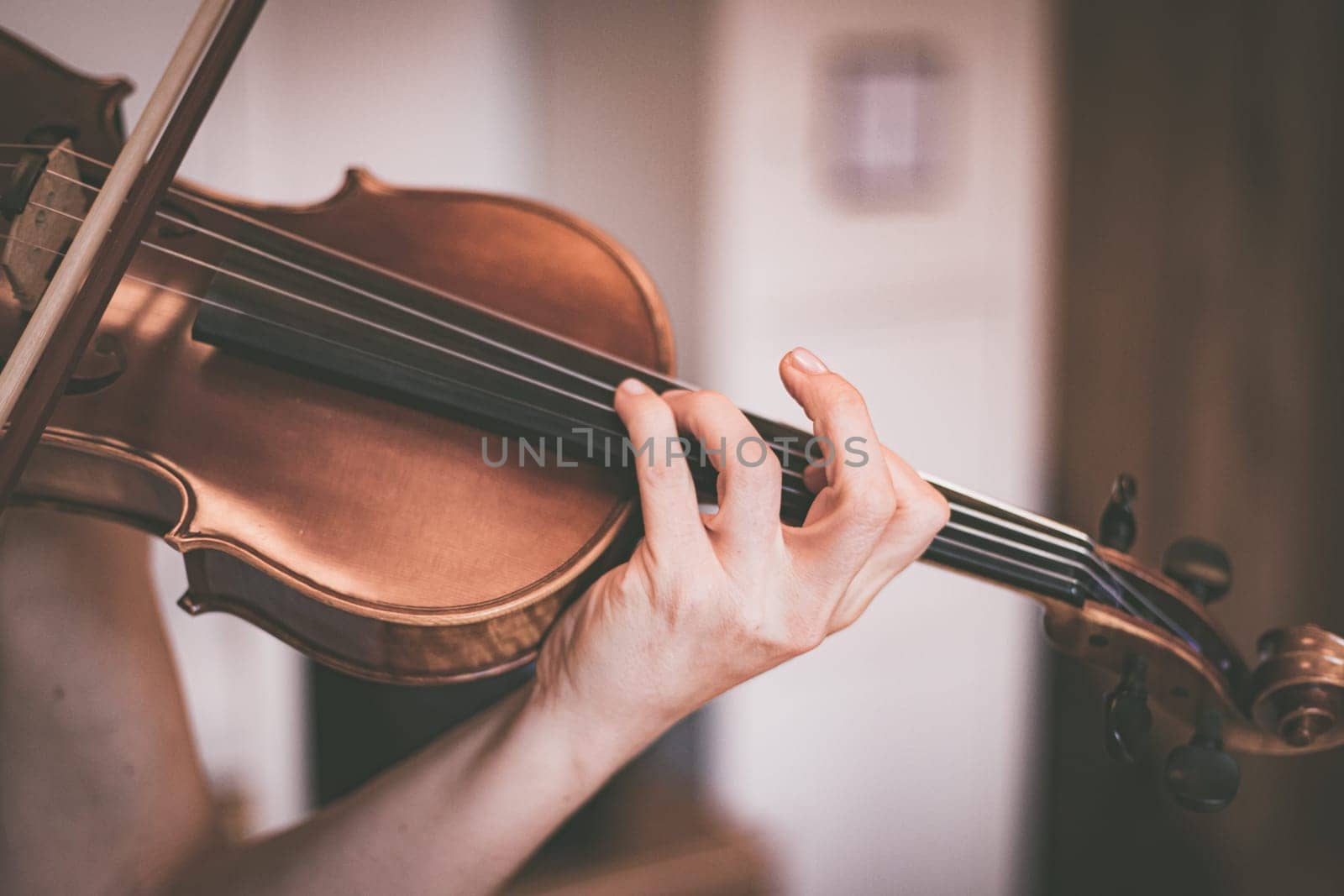 Young girl practices on her violin, acoustic music