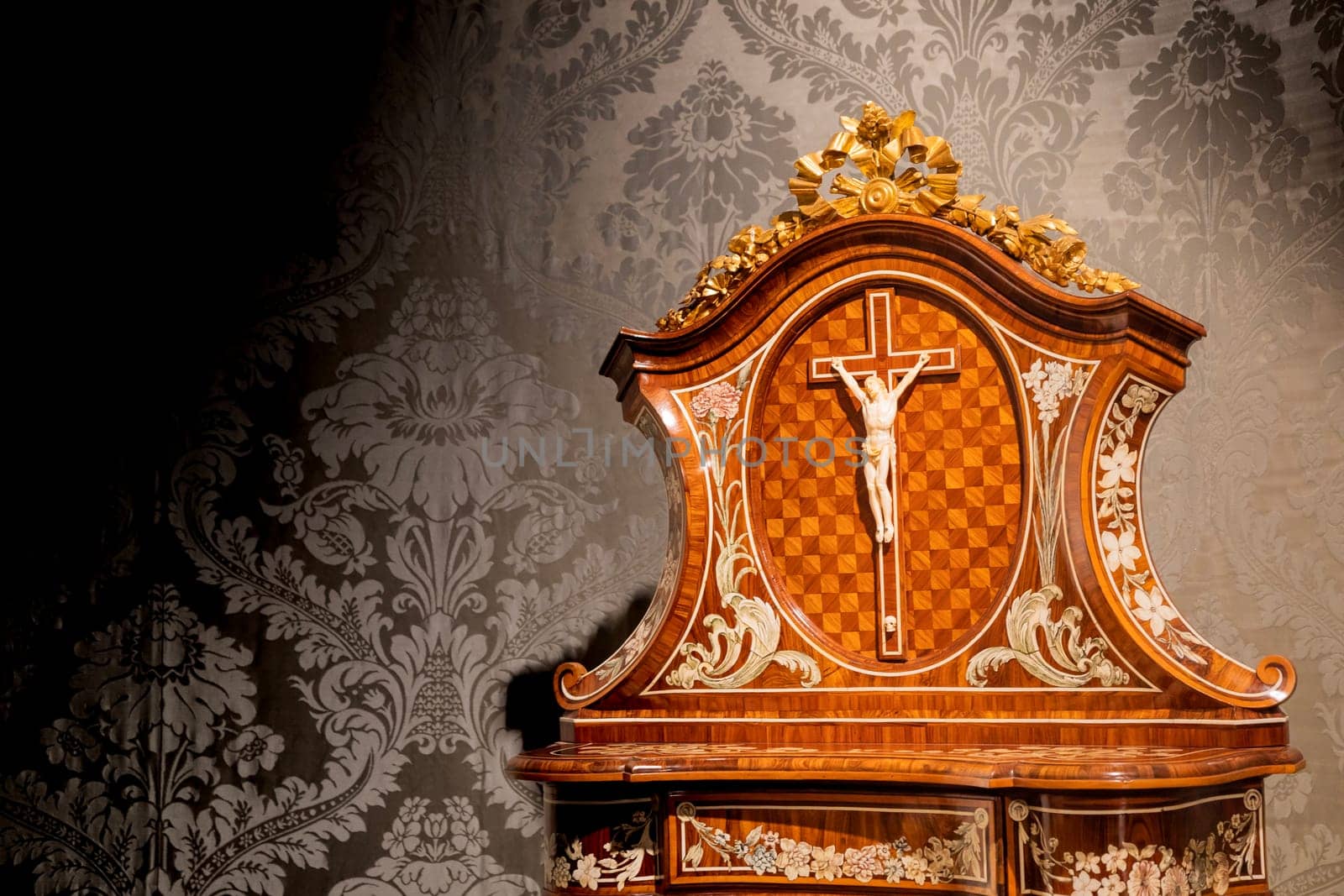TURIN, ITALY - CIRCA MAY 2021: old crucifix made of wood and ivory (1750). Jesus Christ symbol of resurrection and life after the death.